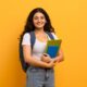 Education,Concept.,Positive,Smiling,Indian,Woman,Student,Holding,Notebooks,Looking